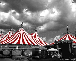 Black and white photo with  red and white circus tents, Step Right Up, Coney Island circus against a cloudy sky.